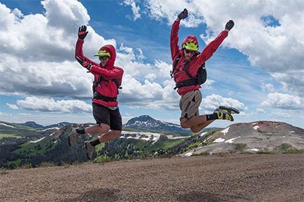 Our Guides 2 excited mountain bike guides jumping up.